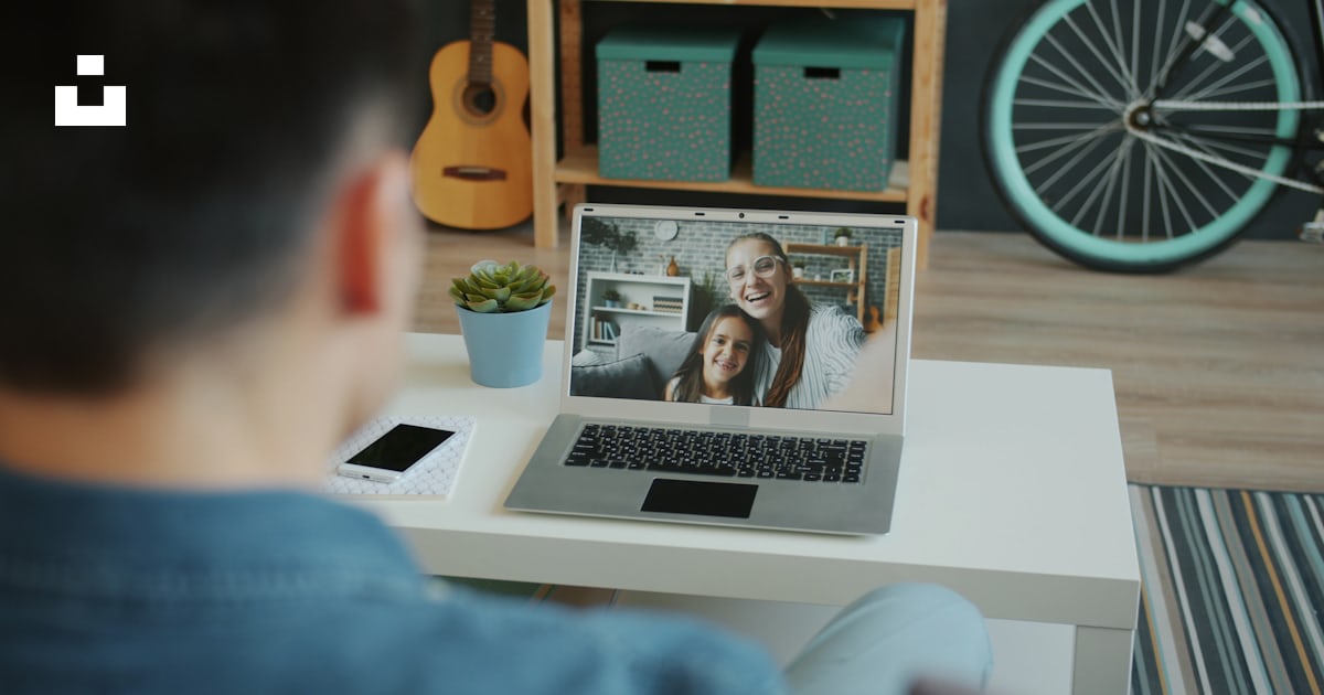 Adult in a live one-to-one video conversation on a laptop